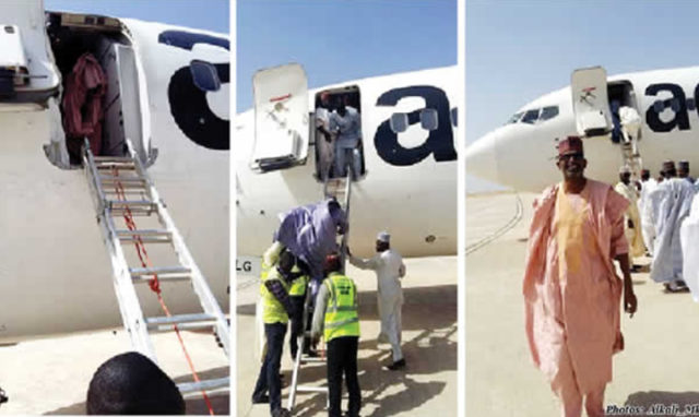 Nigeria passengers alight aircraft using a ladder